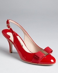 A logo ornament tops the grosgrain-wrapped toes of these chic, sleek patent heels. From Salvatore Ferragamo. A logo ornament tops the grosgrain-wrapped toes of these chic, sleek patent heels. From Salvatore Ferragamo.