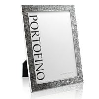 Featuring a slender border of gleaming plated silver in a textural petite reptile pattern, this frame by Argento handsomely complements favorite photos, imparting a look that's at once classic and modern.