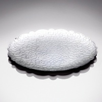 This polished, patterned round tray by designer Marcel Wanders makes a stunning centerpiece for your tabletop. This polished, patterned round tray by designer Marcel Wanders makes a stunning centerpiece for your tabletop.