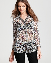 This seasonless Equipment shirt features a playful neon leopard print and a high/low hem on a lavish silk silhouette. This seasonless Equipment shirt features a playful neon leopard print and a high/low hem on a lavish silk silhouette.