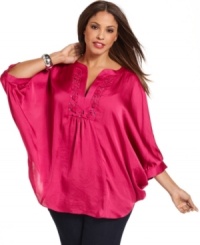 Get swept away by the romantic elegance of Alfani's batwing sleeve plus size top, featuring a rosette neckline. Get swept away by the romantic elegance of Alfani's batwing sleeve plus size top, featuring a rosette neckline.
