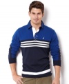Stripes go sporty on this sharp color-blocked polo shirt from Nautica.