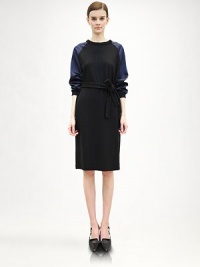 A sporty silhouette gets an elegant update, in finespun wool with luxe satin contrast sleeves.Banded jewel necklineLong satin raglan sleevesBanded cuffsRemovable sash beltWoolDry cleanMade in ItalyModel shown is 5'11 (180cm) wearing US size 4. A sporty silhouette gets an elegant update, in finespun wool with luxe satin contrast sleeves.Banded jewel necklineLong satin raglan sleevesBanded cuffsRemovable sash beltWoolDry cleanMade in ItalyModel shown is 5'11 (180cm) wearing US size 4.