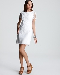 A sheer lace overlay injects this prim Elie Tahari dress with youthful joie de vivre, while sheer sleeves and and a high hemline impart flirtatious sophistication. A sheer lace overlay injects this prim Elie Tahari dress with youthful joie de vivre, while sheer sleeves and and a high hemline impart flirtatious sophistication.