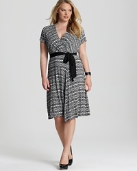 An eye-catching tribal print lends contemporary edge to the classic DKNYC wrap dress. Finish the look with a printed tote for an on-trend pattern play. An eye-catching tribal print lends contemporary edge to the classic DKNYC wrap dress. Finish the look with a printed tote for an on-trend pattern play.