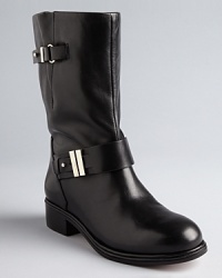 Rachel Roy takes the moto trend uptown, embellishing sleek, polished boots with elegant hardware. Rachel Roy takes the moto trend uptown, embellishing sleek, polished boots with elegant hardware.