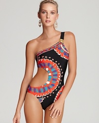 Demurely alluring, this Trina Turk one piece shows off your shoulders and side in one irresistible silhouette in a get-noticed pattern. Demurely alluring, this Trina Turk one piece shows off your shoulders and side in one irresistible silhouette in a get-noticed pattern.