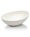 With the natural appeal of hand-thrown pottery, the Swirl White vegetable bowl achieves unfussy elegance in classic stoneware. Coordinates with Mikasa white dinnerware. The dishes have a smooth, glossy surface that contrasts the matte ribbed exterior for dynamic casual tables.