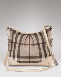 Add a chic addition to your workday wardrobe with this checked crossbody bag from Burberry. Add a chic addition to your workday wardrobe with this checked crossbody bag from Burberry.