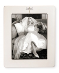 Part of the beloved collection from kate spade, this frame features a graceful dragonfly motif on fine ivory bone china. The perfect way to add a touch of fanciful whimsy to your favorite photo. Part of the beloved collection from kate spade, this frame features a graceful dragonfly motif on fine ivory bone china. The perfect way to add a touch of fanciful whimsy to your favorite photo.