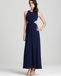 A skin-revealing back cutout lends a modern edge to this Susana Monaco maxi dress, cut in a sleek, minimalist silhouette. A skin-revealing back cutout lends a modern edge to this Susana Monaco maxi dress, cut in a sleek, minimalist silhouette.