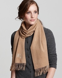 In luxe cashmere, this Burberry scarf offers indulgent warmth in a solid, versatile hue. In luxe cashmere, this Burberry scarf offers indulgent warmth in a solid, versatile hue.