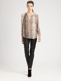 A slim, feminine style articulated in bold snake-print silk.Split v-neckLong sleevesShirttail hemPullover styleSilkDry cleanImportedModel shown is 5'10 (177cm) wearing US size Small. A slim, feminine style articulated in bold snake-print silk.Split v-neckLong sleevesShirttail hemPullover styleSilkDry cleanImportedModel shown is 5'10 (177cm) wearing US size Small.