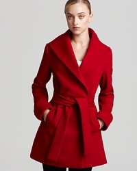 A belted Trina Trina coat, cut in a double-breasted silhouette, takes you through your schedule with sophistication--smart for the office and sharp for off-hour events. A belted Trina Trina coat, cut in a double-breasted silhouette, takes you through your schedule with sophistication--smart for the office and sharp for off-hour events.