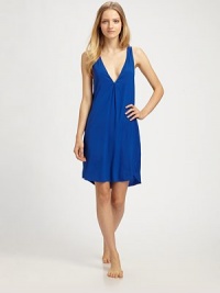 A simple V-neck shift of supple silk chiffon, finished with a bold colorblock back.V necklineSleevelessShirttail hemV-back with center ruchingAbout 20 from natural waist93% silk/7% elastaneHand washImported A simple V-neck shift of supple silk chiffon, finished with a bold colorblock back.V necklineSleevelessShirttail hemV-back with center ruchingAbout 20 from natural waist93% silk/7% elastaneHand washImported