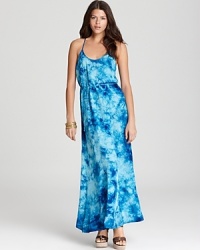 This C&C California maxi dress effortlessly goes from day to night with a splashy tie-dye print and floor-sweeping silhouette. This C&C California maxi dress effortlessly goes from day to night with a splashy tie-dye print and floor-sweeping silhouette.