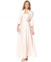 Jessica Howard's petite evening gown is adorned with a pleated, bead-embellished waistline and complemented by a cropped jacket with three-quarter sleeves.
