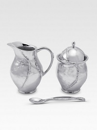 A handmade creamer and sugar set in hammered, sandcast aluminum, buffed by hand for unparalleled shine and elegance. Set includes sugar bowl with lid, creamer and matching spoon Creamer, 4½H X 3 diam. Sugar, 4½H X 3 diam. Spoon, 5 long Sandcast aluminum Food safe Hand wash Imported A handmade creamer and sugar set in hammered, sandcast aluminum, buffed by hand for unparalleled shine and elegance. Set includes sugar bowl with lid, creamer and matching spoon Creamer, 4½H X 3 diam. Sugar, 4½H X 3 diam. Spoon, 5 long Sandcast aluminum Food safe Hand wash Imported