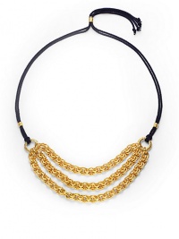 THE LOOKThree bold, graduated golden chainsDouble strands of braided navy cordSliding, adjustable lariat-style bead closeTHE FITChain length, about 9Overall length, about 42THE MATERIALRayon cord24k gold platingORIGINMade in USA THE LOOKThree bold, graduated golden chainsDouble strands of braided navy cordSliding, adjustable lariat-style bead closeTHE FITChain length, about 9Overall length, about 42THE MATERIALRayon cord24k gold platingORIGINMade in USA