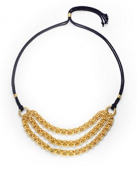 THE LOOKThree bold, graduated golden chainsDouble strands of braided navy cordSliding, adjustable lariat-style bead closeTHE FITChain length, about 9Overall length, about 42THE MATERIALRayon cord24k gold platingORIGINMade in USA