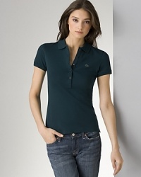 A hail to classic sportswear, this short-sleeve Lacoste polo shirt infuses your off-duty wardrobe with timeless appeal. Give it a new season spin with printed pants. A hail to classic sportswear, this short-sleeve Lacoste polo shirt infuses your off-duty wardrobe with timeless appeal. Give it a new season spin with printed pants.