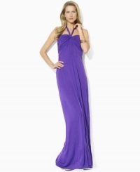 A flowing maxi dress crafted from slinky stretch jersey is designed with a flattering halter-top silhouette and gentle ruching along the bodice for easy, comfortable style, from Lauren by Ralph Lauren. A flowing maxi dress crafted from slinky stretch jersey is designed with a flattering halter-top silhouette and gentle ruching along the bodice for easy, comfortable style, from Lauren by Ralph Lauren.