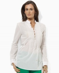 A pretty pin tucked tunic is elegantly crafted in airy cotton and finished with graceful button and loop closures for a romantic flourish, from Lauren by Ralph Lauren. A pretty pin tucked tunic is elegantly crafted in airy cotton and finished with graceful button and loop closures for a romantic flourish, from Lauren by Ralph Lauren.