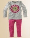 She'll love the swirl of flower petals appliquéd on the front of this fun design.CrewneckSelf ruffles trim the shouldersPull-on styleColorful petal appliqués on the frontCottonMachine washImported