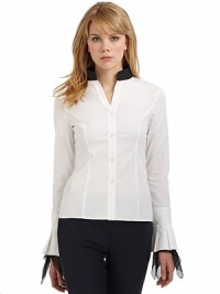 THE LOOKContrast stand collarLong sleeves with pleated cuffsAsymmetric contrast silk ruffles trim the cuffsButton frontTHE FITAbout 22 from shoulder to hemTHE MATERIAL97% cotton/3% other fibersSilk trimCARE & ORIGINDry cleanImportedModel shown is 5'10 (177cm) wearing US size 4. THE LOOKContrast stand collarLong sleeves with pleated cuffsAsymmetric contrast silk ruffles trim the cuffsButton frontTHE FITAbout 22 from shoulder to hemTHE MATERIAL97% cotton/3% other fibersSilk trimCARE & ORIGINDry cleanImportedModel shown is 5'10 (177cm) wearing US size 4.