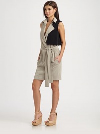 Italian crepe de chine creates the perfect backdrop for this sleek, tailored design with a flattering self-tie belt. Notched collarEpaulettesSleevelessConcealed snap closureSelf-tie belt at gathered waistAbout 21 from natural waistPolyesterDry cleanMade in USA of Italian fabric Model shown is 5'9½ (176cm) wearing US size 4. Italian crepe de chine creates the perfect backdrop for this sleek, tailored design with a flattering self-tie belt. Notched collarEpaulettesSleevelessConcealed snap closureSelf-tie belt at gathered waistAbout 21 from natural waistPolyesterDry cleanMade in USA of Italian fabric Model shown is 5'9½ (176cm) wearing US size 4.