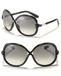 Round oversized sunglasses with streamlined curves and knotted detail at temples for a unique style from Tom Ford. Round oversized sunglasses with streamlined curves and knotted detail at temples for a unique style from Tom Ford.