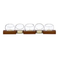 Add an artful candlelit showcase to the table or mantel with this striking display object from Dansk. In an elegant pairing of raw materials and minimalist design, blocks of richly grained wood lend warm balance to cylindrical bubbles formed of sparkling clear glass. Add an artful candlelit showcase to the table or mantel with this striking display object from Dansk. In an elegant pairing of raw materials and minimalist design, blocks of richly grained wood lend warm balance to cylindrical bubbles formed of sparkling clear glass.