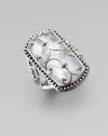 A sophisticated piece adorned in pretty details with a faceted mother-of-pearl doublet, overlaid with a sterling silver scroll pattern and surrounded by a delicate band of dots. Mother-of-pearl doubletSterling silverWidth, about 1Imported 