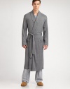 Luxurious, knit robe is incredibly smooth and soft for endless hours of comfort.Shawl collarTie waistFront patch pockets53% polyamide/47% viscoseMachine washImported