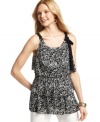 Feminine black-and-white printed ruffles give Style&co.'s petite top a fresh spin. A self-tie bow adds a charming finishing touch! (Clearance)