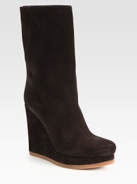 Classic seasonal staple rendered in lush suede with a heightening wedge. Self-covered wedge, 4¾ (120mm)Covered platform, 1 (25mm)Compares to a 3¾ heel (95mm)Shaft, 9½Leg circumference, 12½Suede upperPull-on styleLeather liningRubber solePadded insoleMade in ItalyOUR FIT MODEL RECOMMENDS ordering one half size up as this style runs small. Classic seasonal staple rendered in lush suede with a heightening wedge. Self-covered wedge, 4¾ (120mm)Covered platform, 1 (25mm)Compares to a 3¾ heel (95mm)Shaft, 9½Leg circumference, 12½Suede upperPull-on styleLeather liningRubber solePadded insoleMade in ItalyOUR FIT MODEL RECOMMENDS ordering one half size up as this style runs small.