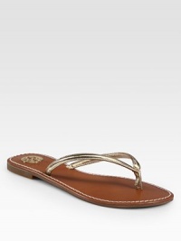 Metallic leather thong with a logoed footbed and rubber sole for traction. Metallic leather upperLeather liningRubber soleImportedOUR FIT MODEL RECOMMENDS ordering true whole size; ½ sizes should order the next whole size down. Metallic leather thong with a logoed footbed and rubber sole for traction. Metallic leather upperLeather liningRubber soleImportedOUR FIT MODEL RECOMMENDS ordering true whole size; ½ sizes should order the next whole size down.