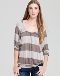 Ella Moss makes casual look chic with this striped top, cut in a billowy silhouette with a gathered neckline and banded hem. Ella Moss makes casual look chic with this striped top, cut in a billowy silhouette with a gathered neckline and banded hem.
