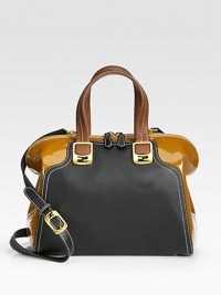 Instantly polished and chic, a two-tone design of lustrous patent leather and leather, with contrast stitching and sleek hardware. Double top handles, 5 dropAdjustable detachable shoulder strap, 18-24½ dropTop zip closureProtective metal feetTwo inside open pocketsFully lined12W X 10H X 6DMade in Italy Instantly polished and chic, a two-tone design of lustrous patent leather and leather, with contrast stitching and sleek hardware. Double top handles, 5 dropAdjustable detachable shoulder strap, 18-24½ dropTop zip closureProtective metal feetTwo inside open pocketsFully lined12W X 10H X 6DMade in Italy