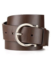 Salvatore Ferragamo's signature Gancini logo buckle brings a touch of charm to this handsome leather belt. Salvatore Ferragamo's signature Gancini logo buckle brings a touch of charm to this handsome leather belt.