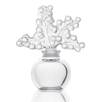Originally designed in 1931 by Rene Lalique. this elegant perfume bottle is topped with a burst of lilies of the valley. Originally designed in 1931 by Rene Lalique. this elegant perfume bottle is topped with a burst of lilies of the valley.