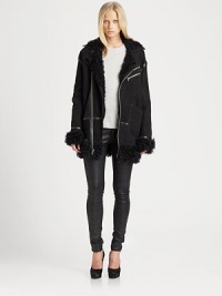 Soft, aviator-inspired leather jacket, defined by plush shearling, contrast trim and a length that hits below the hips. Soft, aviator-inspired leather jacket, defined by plush shearling, contrast trim and a length that hits below the hips.