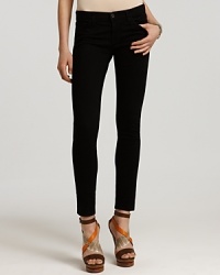 J Brand's skinny black jeans are a must-have for seasonless super-sleek style. Tonal stitching and antique black hardware keep the look inky and with coordinating silk top and pumps, the single-hued effect is simply sexy. J Brand's skinny black jeans are a must-have for seasonless super-sleek style. Tonal stitching and antique black hardware keep the look inky and with coordinating silk top and pumps, the single-hued effect is simply sexy.