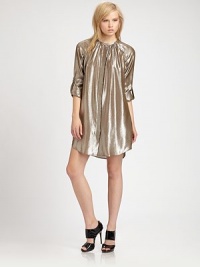 Shimmery, prettily gathered silk lame, rendered with shirt-tailoring details.Gathered jewel necklineConcealed button frontLong sleeves with roll-tab cuffsGathers at back yokeAbout 15 from natural waist69% silk/31% metallicDry cleanMade in USA of imported fabricModel shown is 5'7 (170cm) wearing US size 4. Shimmery, prettily gathered silk lame, rendered with shirt-tailoring details.Gathered jewel necklineConcealed button frontLong sleeves with roll-tab cuffsGathers at back yokeAbout 15 from natural waist69% silk/31% metallicDry cleanMade in USA of imported fabricModel shown is 5'7 (170cm) wearing US size 4.