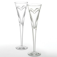 Enhance each toast you make at every special occasion. Where there is Love & Romance, there must be champagne! Whether celebrating your third date, 10th anniversary or millionth declaration of love, what better way to show it than with Waterford Crystal toasting flutes filled with champagne. These flutes were designed with a simple and elegant entwined double heart, representing the love and romance you share. Set of 2; 5 oz. Enhance each toast you make at every special occasion. Where there is Love & Romance, there must be champagne! Whether celebrating your third date, 10th anniversary or millionth declaration of love, what better way to show it than with Waterford Crystal toasting flutes filled with champagne. These flutes were designed with a simple and elegant entwined double heart, representing the love and romance you share. Set of 2; 5 oz.