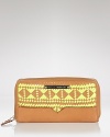 Charge it with this woven leather wallet from Rebecca Minkoff. It's woven leather is in perfect step with this season's tribal-inspired accessories trend, while interior pockets make this punchy piece plenty practical.