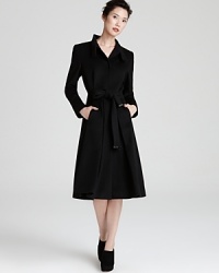 Wrap up in chic style with this sleek-cut Escada coat rendered in warm wool. Wrap up in chic style with this sleek-cut Escada coat rendered in warm wool.