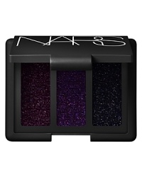 Haute-couture holiday style. Luxe metallic accents mix with the richest jewel tones for the epitome of opulence. Lids smolder with Arabian Nights Trio Eyeshadow, three exquisite moody black hues laced with red, purple and gunmetal pearls and shimmers. Revel in the sensual gold-flecked rose of G-Spot Multiple. Finish with Joyous Red Lipstick, a party-ready amber-red. Bring on the night. NARS Holiday 2011. Haute-couture holiday style. Luxe metallic accents mix with the richest jewel tones for the epitome of opulence. Lids smolder with Arabian Nights Trio Eyeshadow, three exquisite moody black hues laced with red, purple and gunmetal pearls and shimmers. Revel in the sensual gold-flecked rose of G-Spot Multiple. Finish with Joyous Red Lipstick, a party-ready amber-red. Bring on the night. NARS Holiday 2011.