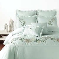 Delicate floral details and billowy ruffles charm on this classic duvet set, featuring two shams, two decorative pillows and a flowing bedskirt.