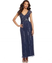 Beyond its fabulous fit, Patra's evening gown is made extra striking with a generous dose of sparkle thanks to shimmering sequins and beading. Beyond its fabulous fit, Patra's evening gown is made extra striking with a generous dose of sparkle thanks to shimmering sequins and beading.